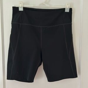 Girlfriend Collective black bike shorts XL- small paint stain.